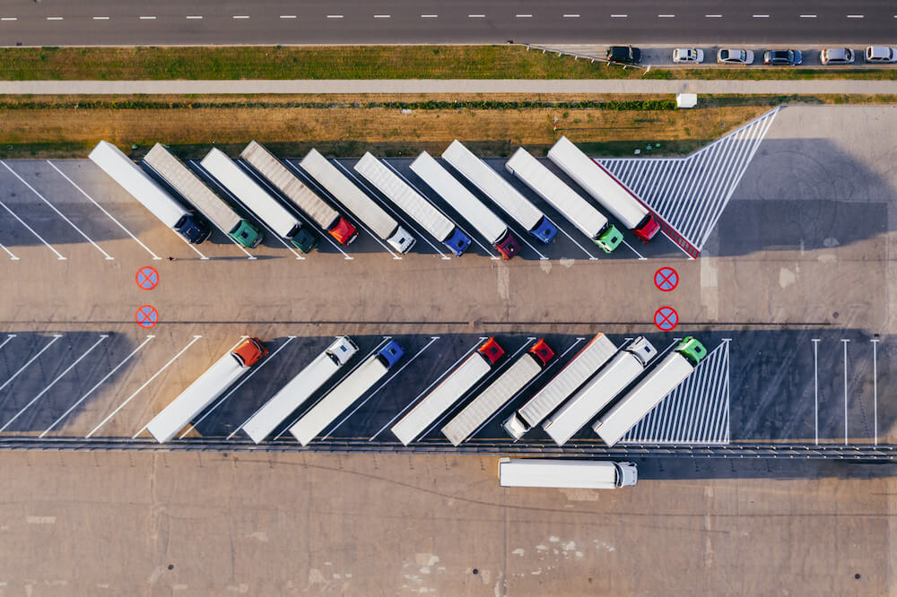 trucks parked beside highway